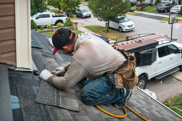 Professional Gutter Installation technician working in Fayville, MA